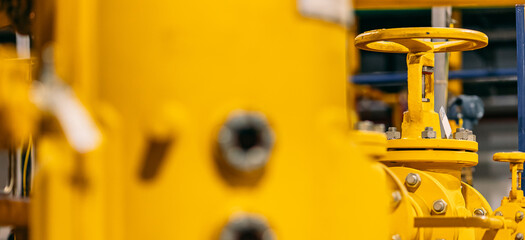 Concept industry power plant background. Yellow pipeline for natural gas with red valves