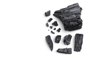 Natural wooden charcoal isolated on white background with full depth of field. Top view with copy space for your text. Flat lay