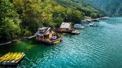 Naklejka premium Raft house on an artificial lake. Big water surface and houses on a lake. Holiday house on water. High contrast and saturation
