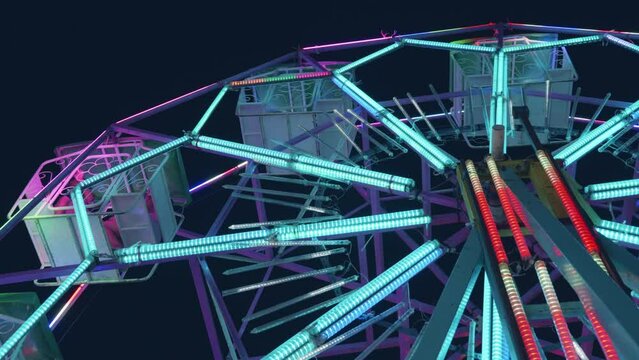 Ferris wheel at night of colorful with outdoor round rotation st Amusement Park, The annual temple event has activities, neon light