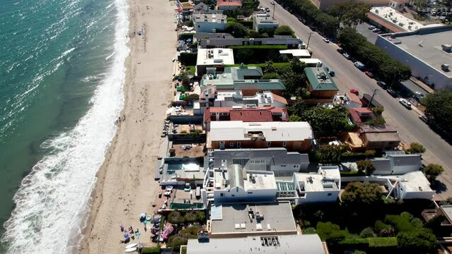 Aerial view looking down at wealthy seafront homes on Malibu beach In California