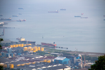View of the harbor by the blue sea filled with ships from the top of the mountain