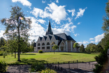 Fototapeta na wymiar Arvidsjaur, Sweden The Arvidsjaur kirke or church on a sunny day.