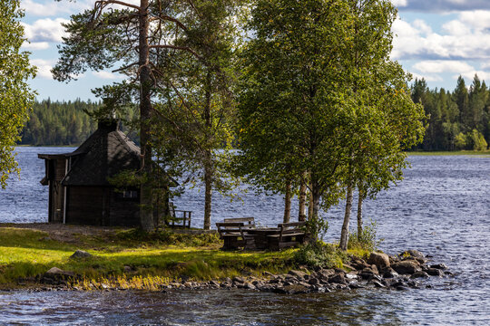 Arvidsjaur, Sweden A small hut that is used as a sauna next to a lake.