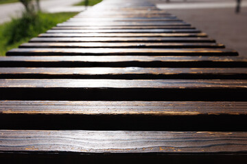 Background of worn wooden planks going into perspective. Selective focus.