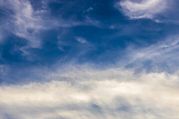 cloudy blue sky with approaching storm clouds, abstract background