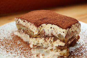 Closeup of a slice of Tiramisu after scooped with spoon