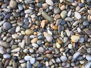 Pebbles, stone texture, natural abstract background. Sea pebbles, close-up.