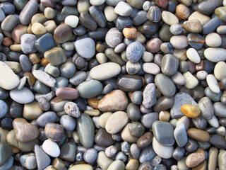 Pebbles, stone texture, natural abstract background. Sea pebbles, close-up.