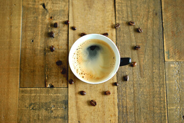 cup of coffee on wooden table