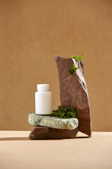Podium of stone on a brown background and moss. Stones, moss, brown colour. Showcase for cosmetic.