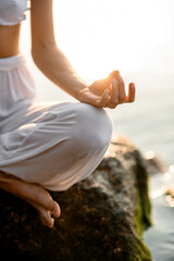focus on female hand practicing yoga gyan mudra position