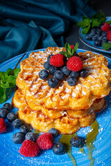 Simple sweet waffles with raspberries and blueberries