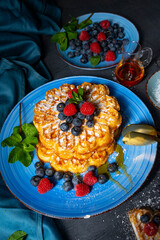 Simple sweet waffles with raspberries and blueberries