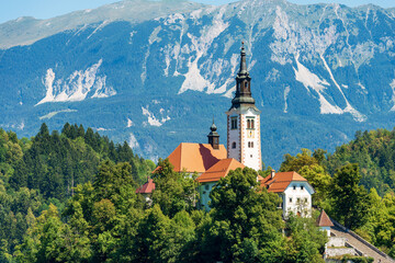 Fototapeta premium Ancient Church of the Mother of God on the Lake (Cerkev Matere bozje na jezeru), XVII century. Lake Bled, Bled Island, Bled town, Gorenjska, Triglav National Park, Alps, Slovenia, central Europe.