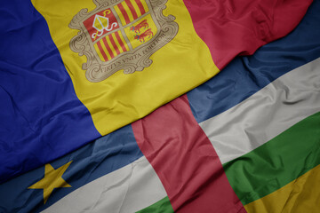 waving colorful flag of central african republic and national flag of andorra.