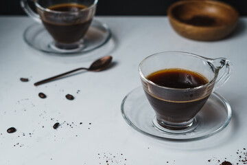 Contemporary style coffee food and drink photo. Set against a white background. Black coffee in...