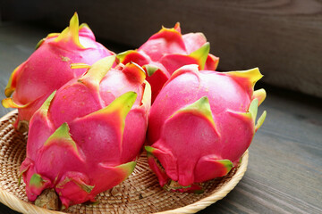 Heap of Fresh Ripe Vivid Pink Dragon Fruits in a Basket
