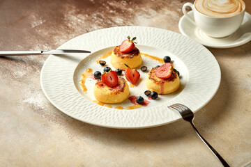 Ukrainian syrniki with jam and berries. Selective focus, close-up