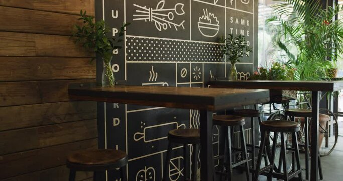 Empty cafe, coffee shop or restaurant with nature, table and chairs architecture inside with green plants. Small business, startup and diner with eco friendly, hospitality and natural store interior