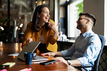 Colleagues in office. Businesswoman and businessman drinking coffee