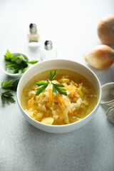 Traditional homemade sauerkraut soup with fresh parsley