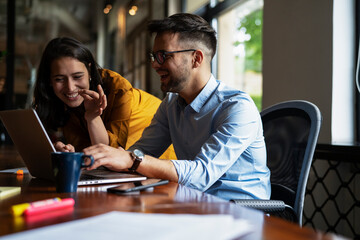 Colleagues in office. Businesswoman and businessman drinking coffee
