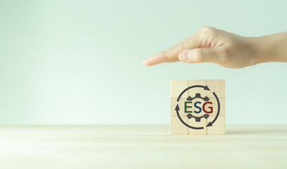 ESG and sustainable development concept. Positive impact for environment, social and governance. Socially responsible investing, ESG factors. Hand protection the earth with ESG strategy solution.