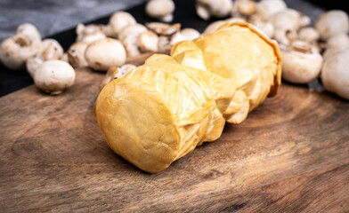 Traditional Polish oscypek, smoked cheese made of salted sheep milk, close up. Delicacy from Tatra Mountains region.