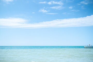 Fototapeta na wymiar Blue sea water surface and blue sky