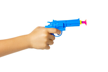 Toy pistol in a child's hand isolated on a white background. Gun on suction cups on a white...