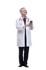 smiling doctor with a smartphone looking at a white screen.