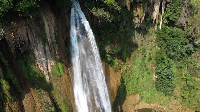A beautiful close up drone shot of Thi Lo Su Waterfall, located deep in the remote jungle, off the beaten track in the backpacker country of Thailand in the area of Umphang in Southeast Asia