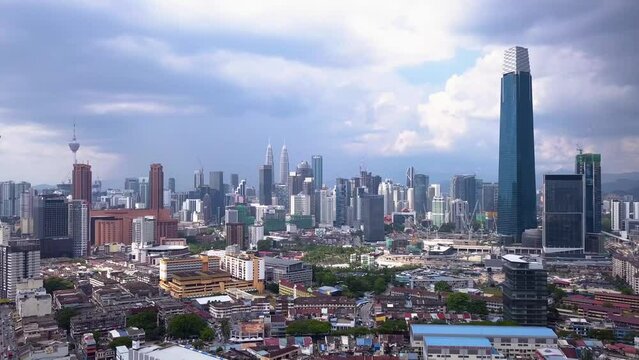 Drone shots of Kuala Lumpur city skyline with skyscrapers, Malaysia, UHD