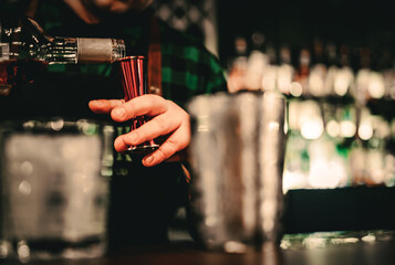 man bartender hand making  cocktail in bar
