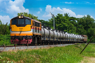Tanker-freight train by diesel locomotive on the railway in Thailand
