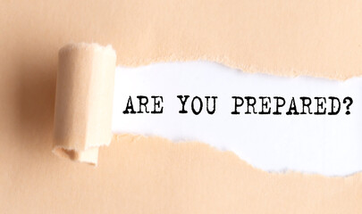 The text ARE YOU PREPARED appears on torn paper on white background.