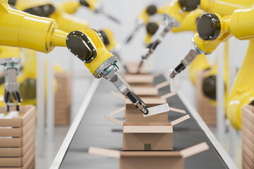 Robots at a conveyor belt packing items into cardboard packages. Detail shot.