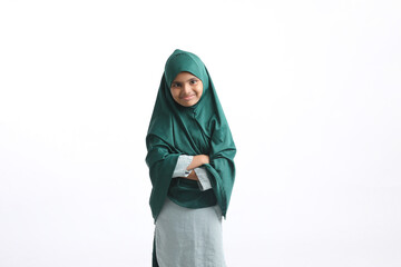 Indian muslim school girl standing on white background.