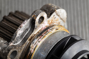 Old leaky car pump. Breakdown of the car pump in the cooling system, macro