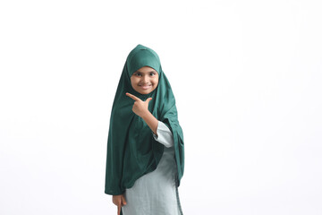 Indian muslim school girl standing on white background.
