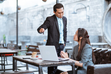 portrait of asian business people having an argument during meeting with partner