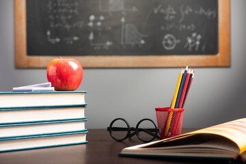 Back to school background with books, pencils and apple