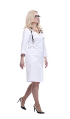 Fototapeta premium confident woman doctor striding forward. isolated on a white