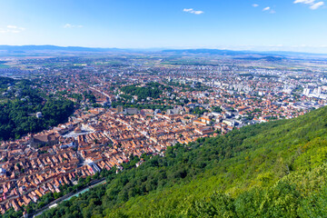 Obraz premium Aerial panorama view over the historical Old Town in the city of Brasov with Tampa mountain in the background. Transylvania, Romania