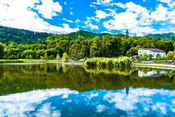 Fototapeta premium Landscape of the Noua lake and vegetation in summer season in Brasov town, Romania