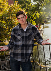 Handsome young man standing with open arms
