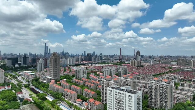 Cityscape and buildings in the downtown city. Drone aerial view. City skyline and rows of buildings in Shanghai China. Real estate development .  Business, economy, real estate concept b-roll footage.