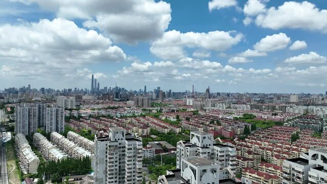 Cityscape and buildings in the downtown city. Drone aerial view. City skyline and rows of buildings in Shanghai China. Real estate development .  Business, economy, real estate concept b-roll footage.