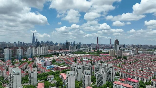 Cityscape and buildings in the downtown city. Drone aerial view. City skyline and rows of buildings in Shanghai China. Real estate development .  Business, economy, real estate concept b-roll footage.